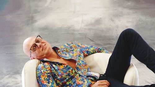 Rear view of woman sitting outdoors