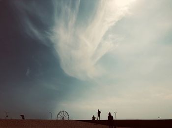 People on field against sky