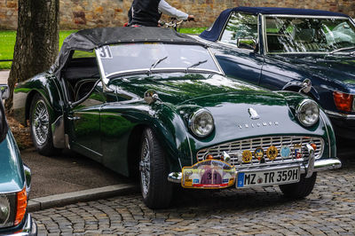 Vintage car parked on street in city