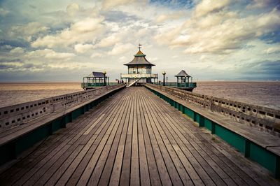 Pier over sea against sky