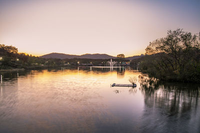 Scenic view of lake against sky during sunset