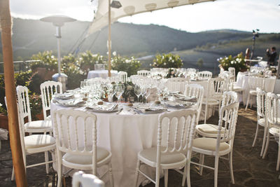 Empty chairs and tables in restaurant