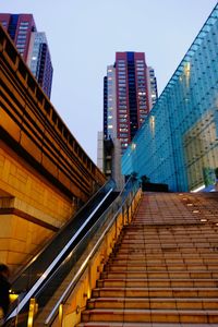 Low angle view of modern buildings against sky in city