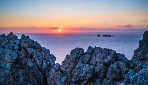 Scenic view of sea against sky during sunset