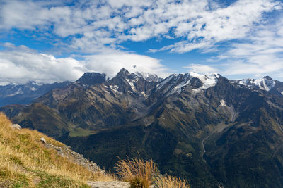 Scenic view of snowcapped mountains against sky