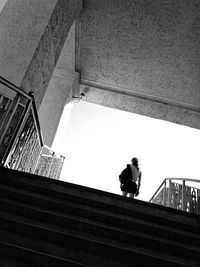 Low angle view of people walking on stairs