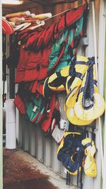 Red and yellow life jackets hanging