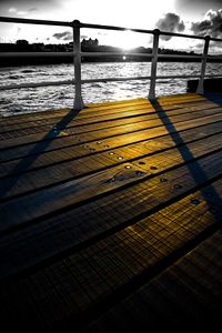 Surface level of wooden footbridge over sea