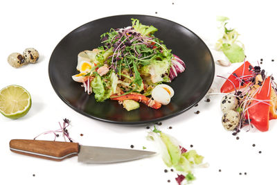 High angle view of salad in bowl on table