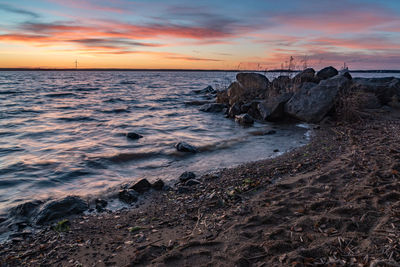 Scenic view of sea against sky during sunset