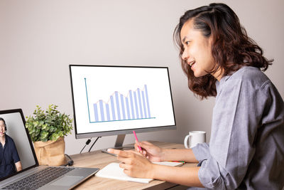 Woman using laptop on table