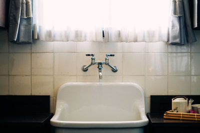 Close-up of faucet in bathroom