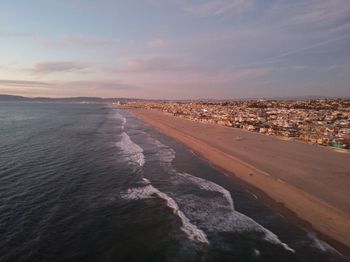 Scenic view of beach against sky during sunset