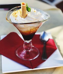 Close-up of ice cream sundae on table