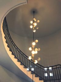 Low angle view of illuminated staircase against sky