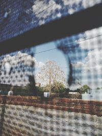 Defocused image of building against sky