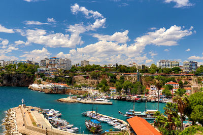 Panoramic view of sea and buildings against sky