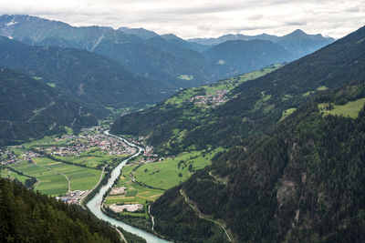 Scenic view of landscape and mountains against sky