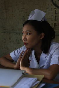 Portrait of young woman using mobile phone