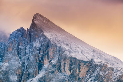 Scenic view of snowcapped mountain against sky during sunset