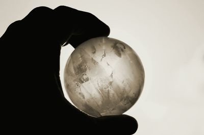 Close-up of hand against white background