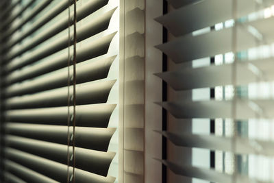 Modern silver aluminum blinds on an office window. 