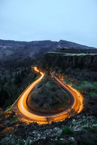 High angle view of light trails on road on mountain