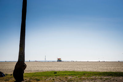 Scenic view of beach against clear sky