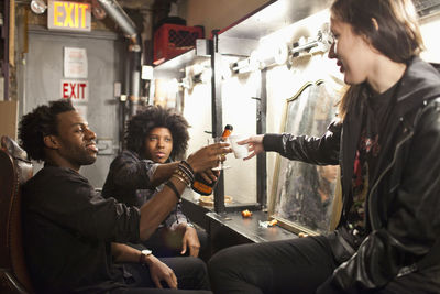 Young people hanging out backstage at a theater