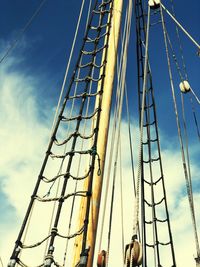 Low angle view of ferris wheel against blue sky