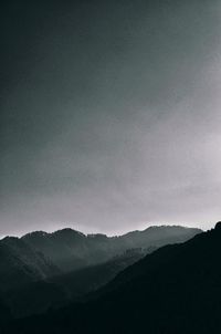 Scenic view of silhouette mountains against clear sky