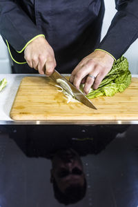 Midsection of man preparing food