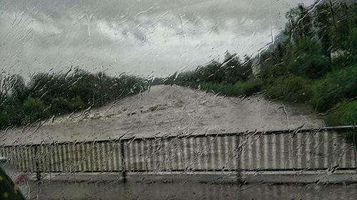 Close-up of wet window during rainy season