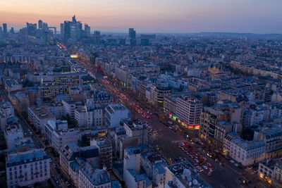 High angle view of illuminated street amidst buildings in city