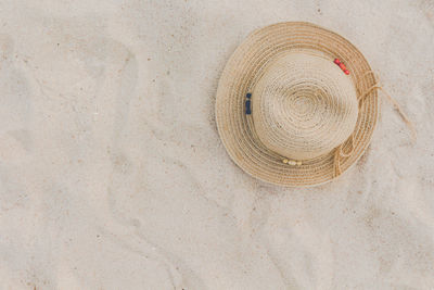 High angle view of hat on sand at beach