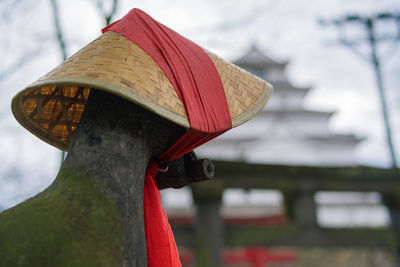 Low angle view of hat against trees