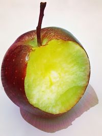 Close-up of fruit over white background