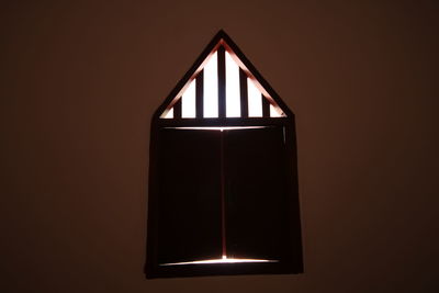 Close-up of illuminated lamp at home