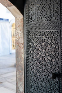 Close-up of metal door of building