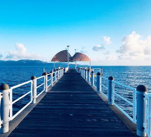 Pier over sea against sky