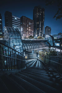 High angle view of illuminated buildings in city at night