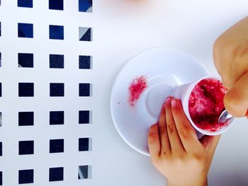 Cropped hand holding ice cream