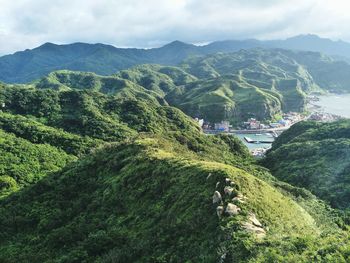 High angle view of trees and mountains against sky