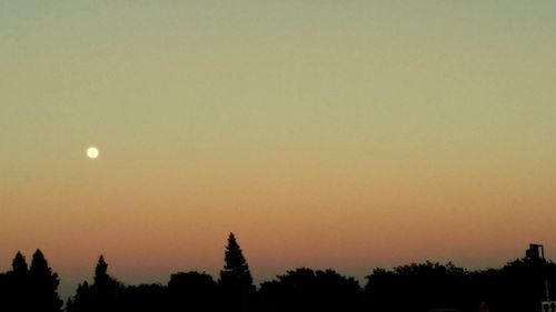 Low angle view of built structure at sunset