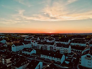 High angle view of townscape against sky during sunset