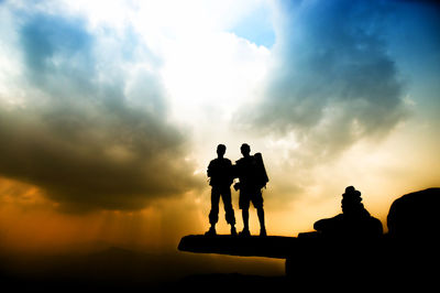 Silhouette of man against cloudy sky