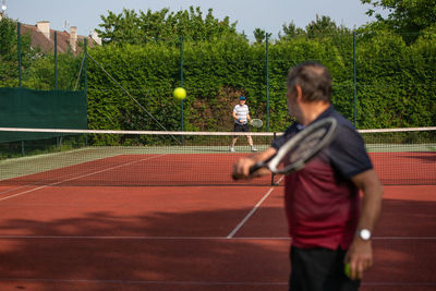 Boy playing tennis