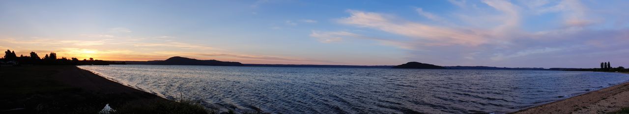 Panoramic view of beach against sky during sunset