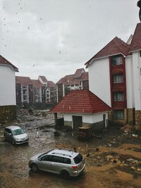 Houses in town against sky