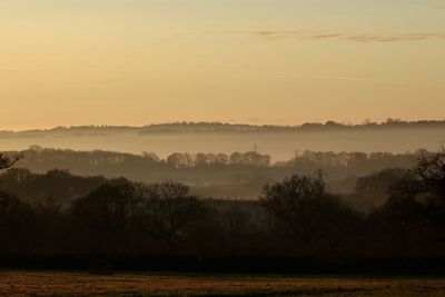 Scenic view of landscape against sky during sunset